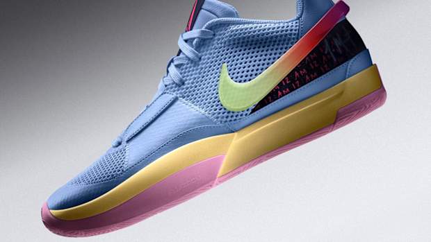Side view of blue and gold Nike Ja shoe.